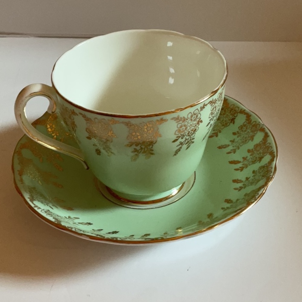 Vintage Adderley fine bone china tea cup. Soft green with gold accents.
